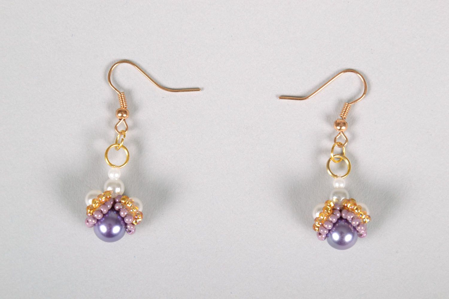 Beaded earrings with charms photo 2