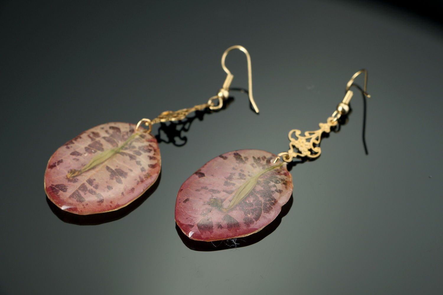 Beautiful earrings with the flowers of bougainvillea photo 1
