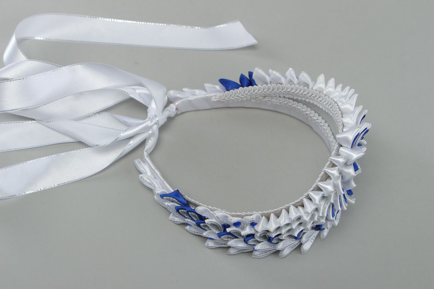 Beautiful volume handmade crown with satin ribbons in white and blue color palette photo 3