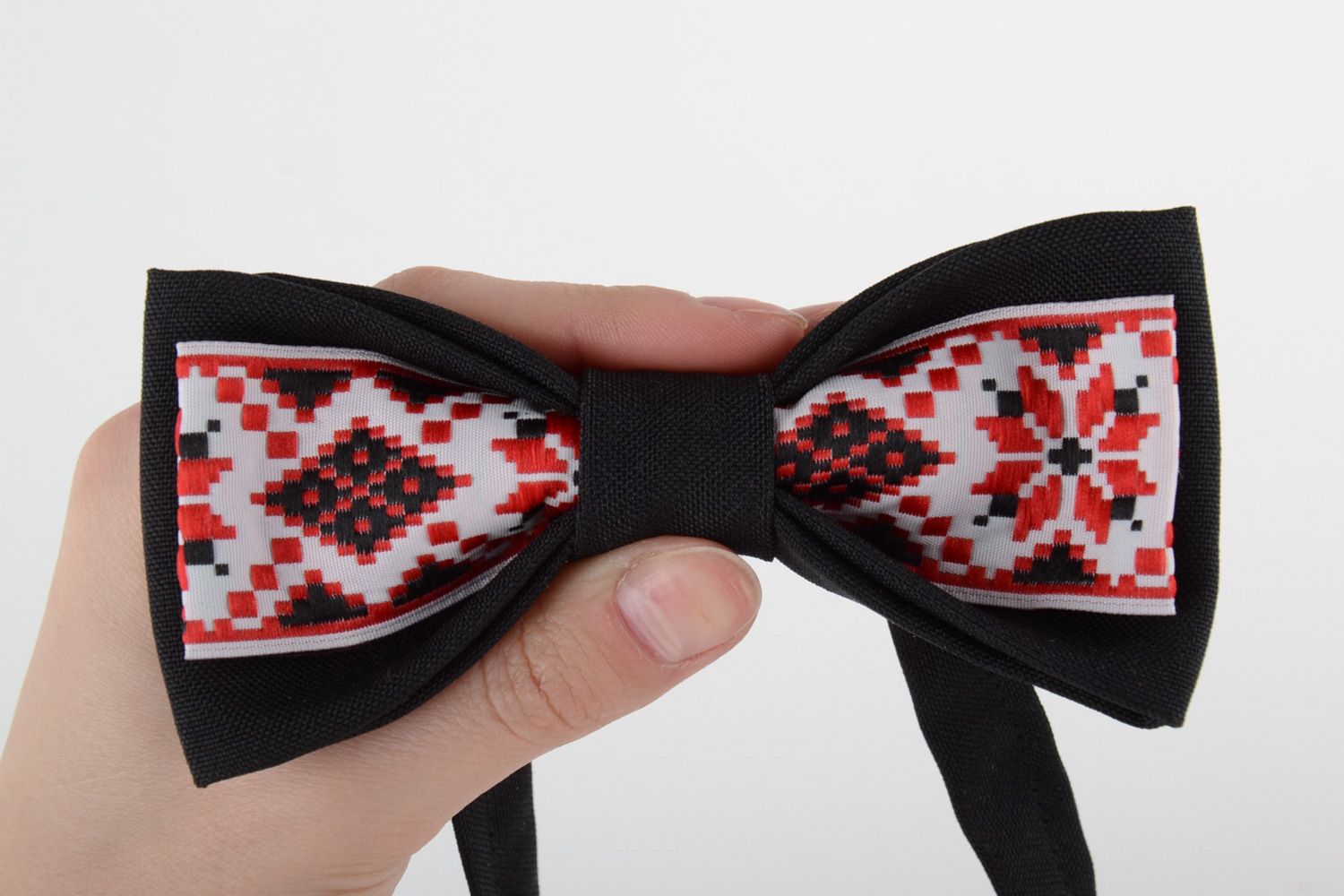 Handmade bow tie sewn of black and ornamented costume fabric in ethnic style photo 5