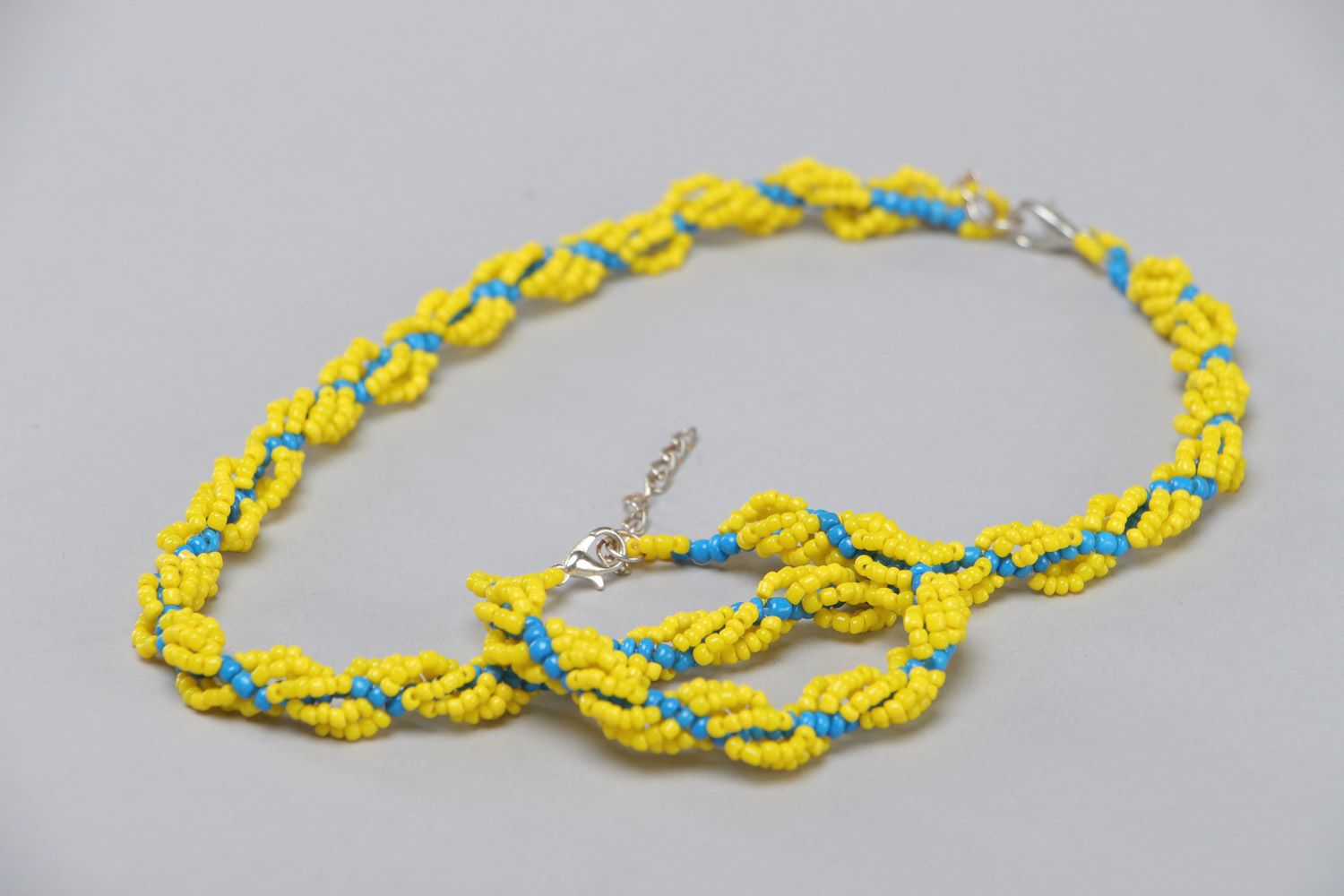 Set of handmade jewelry set necklace and bracelet woven of yellow and blue beads photo 3