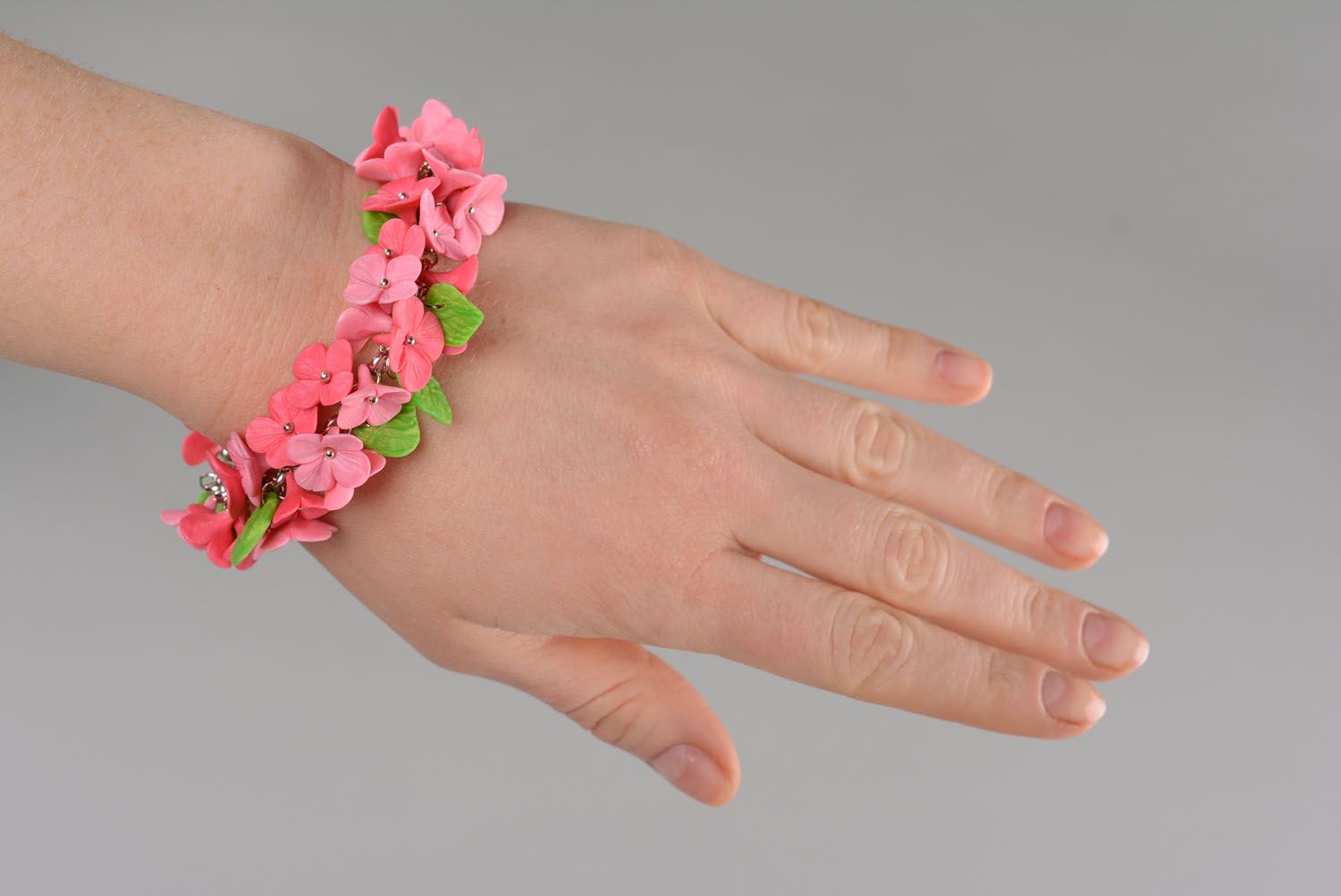 Charm pink field flowers' bracelet with green leafs photo 1