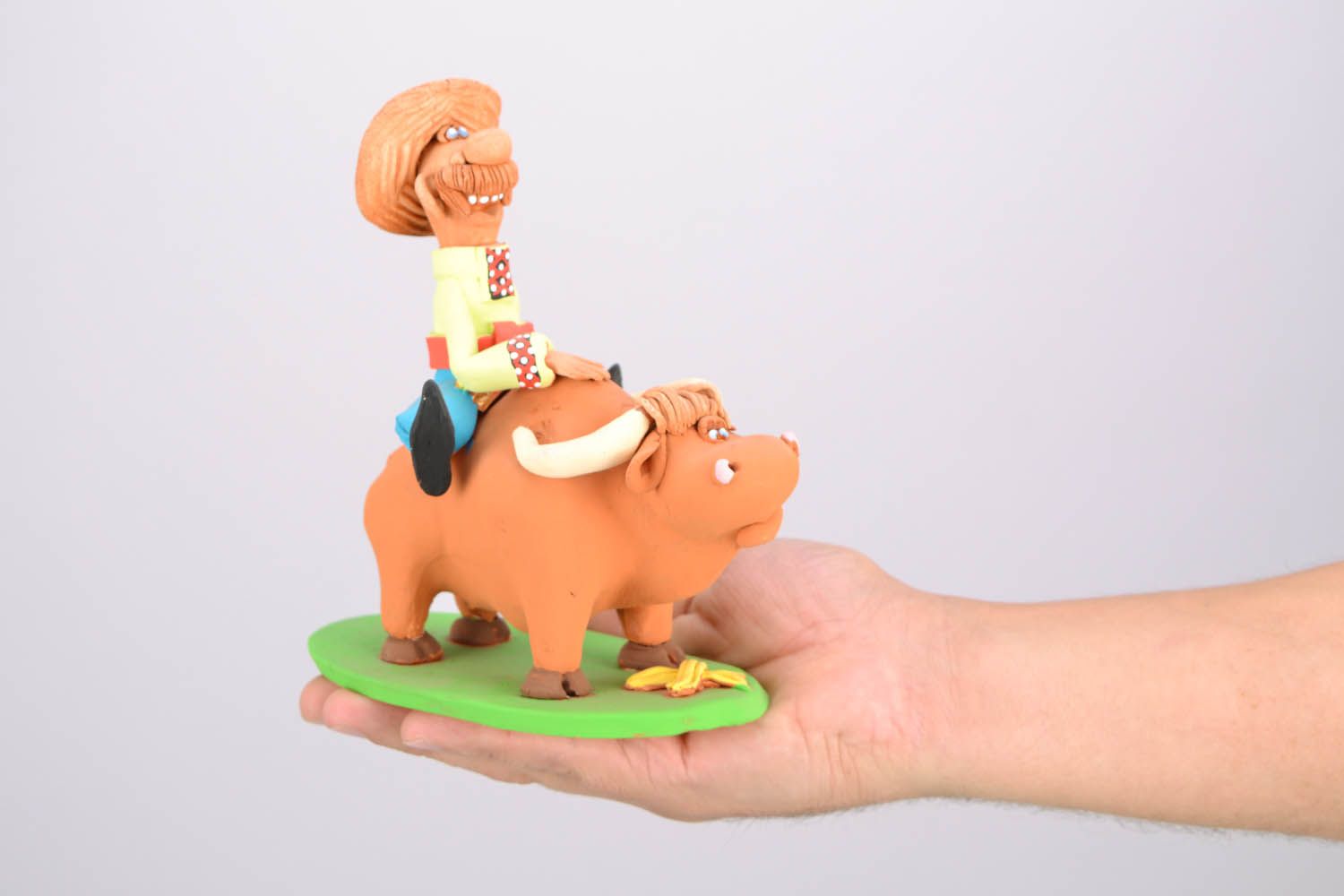 Homemade clay statuette Cossack riding a bull photo 2
