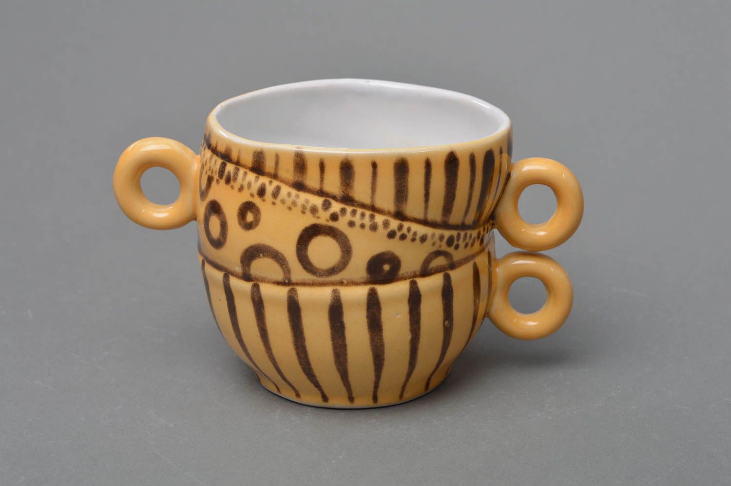 Art ceramic glazed 5 oz coffee cup in yellow and brown colors with three handles  photo 1
