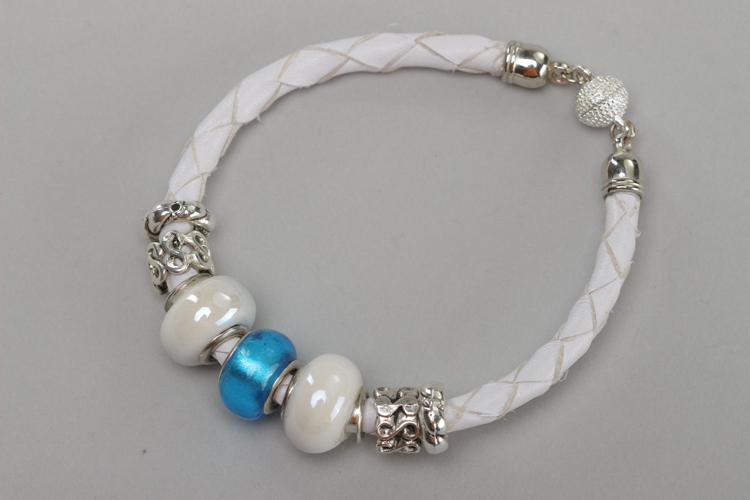 Tender handmade wrist bracelet woven of white faux leather with beads for women photo 2