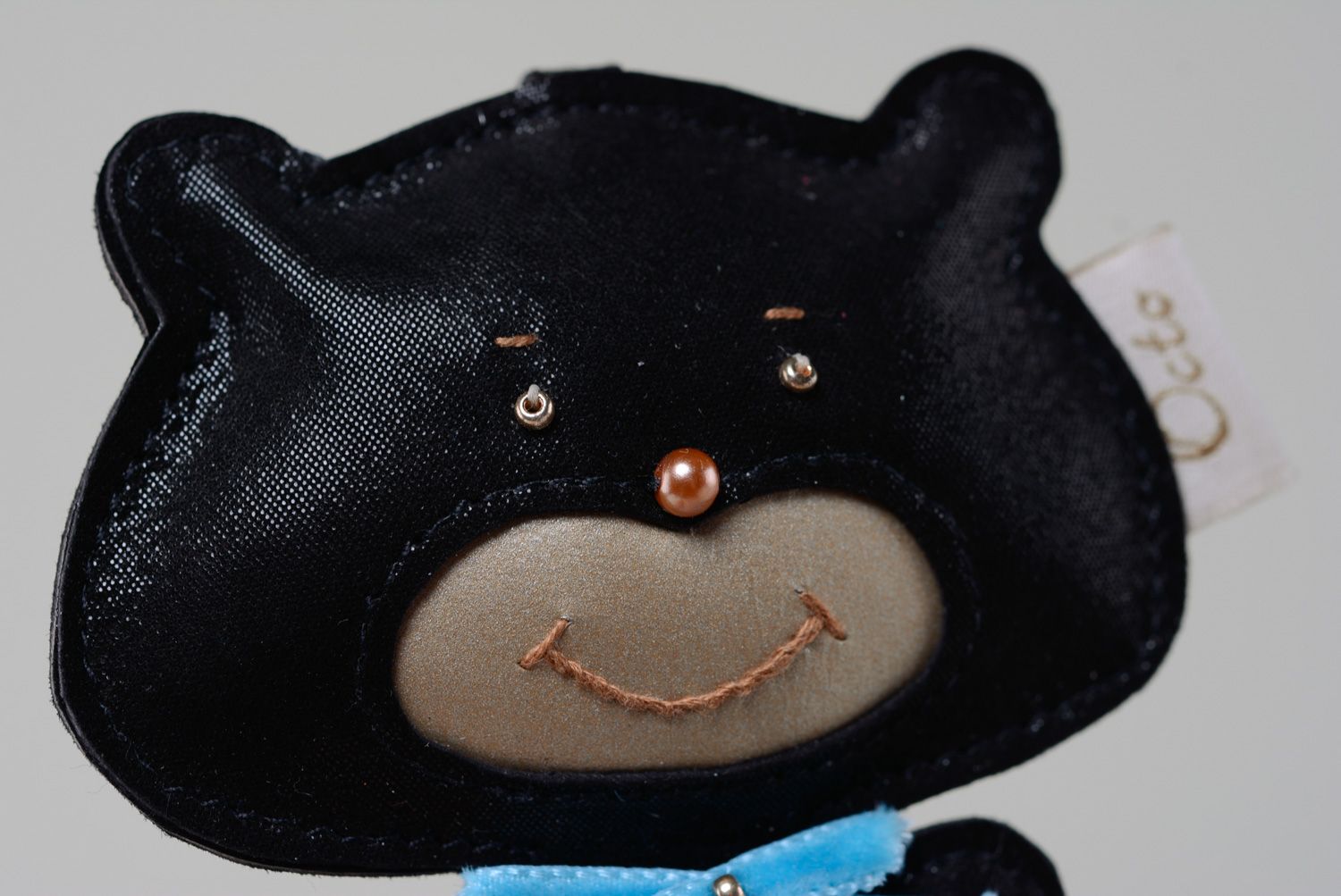 Handmade genuine leather keychain in the shape of black bear with blue bow  photo 2