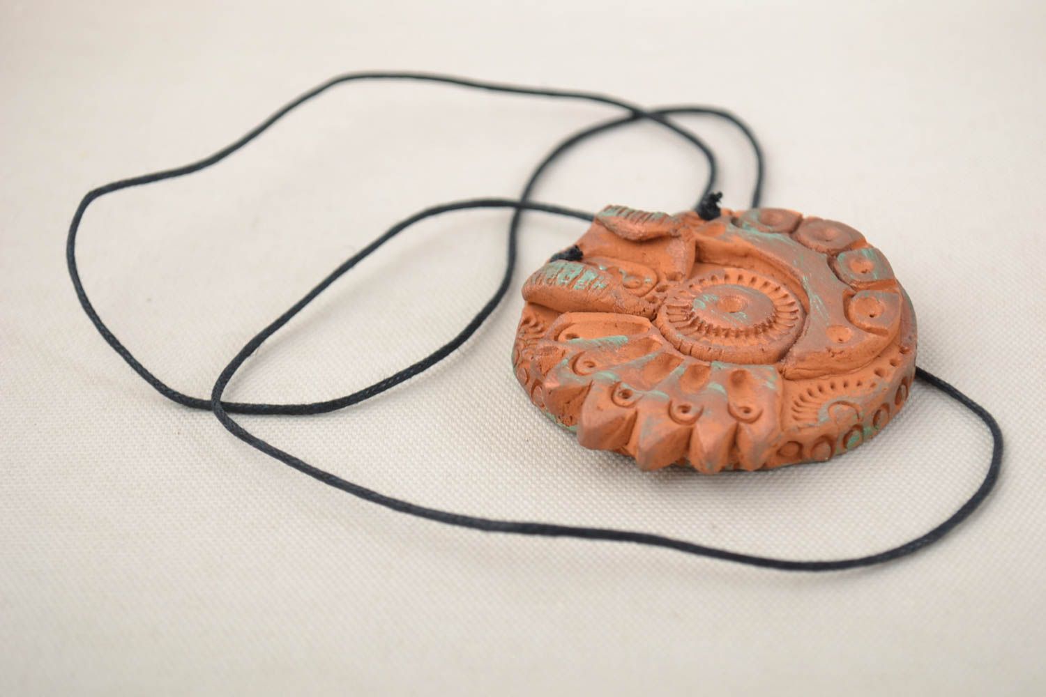 Beautiful round handmade designer brown clay neck pendant on cord photo 1