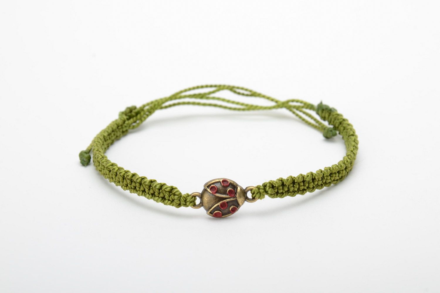 Handmade woven capron thread bracelet of green color with ladybug charm photo 5
