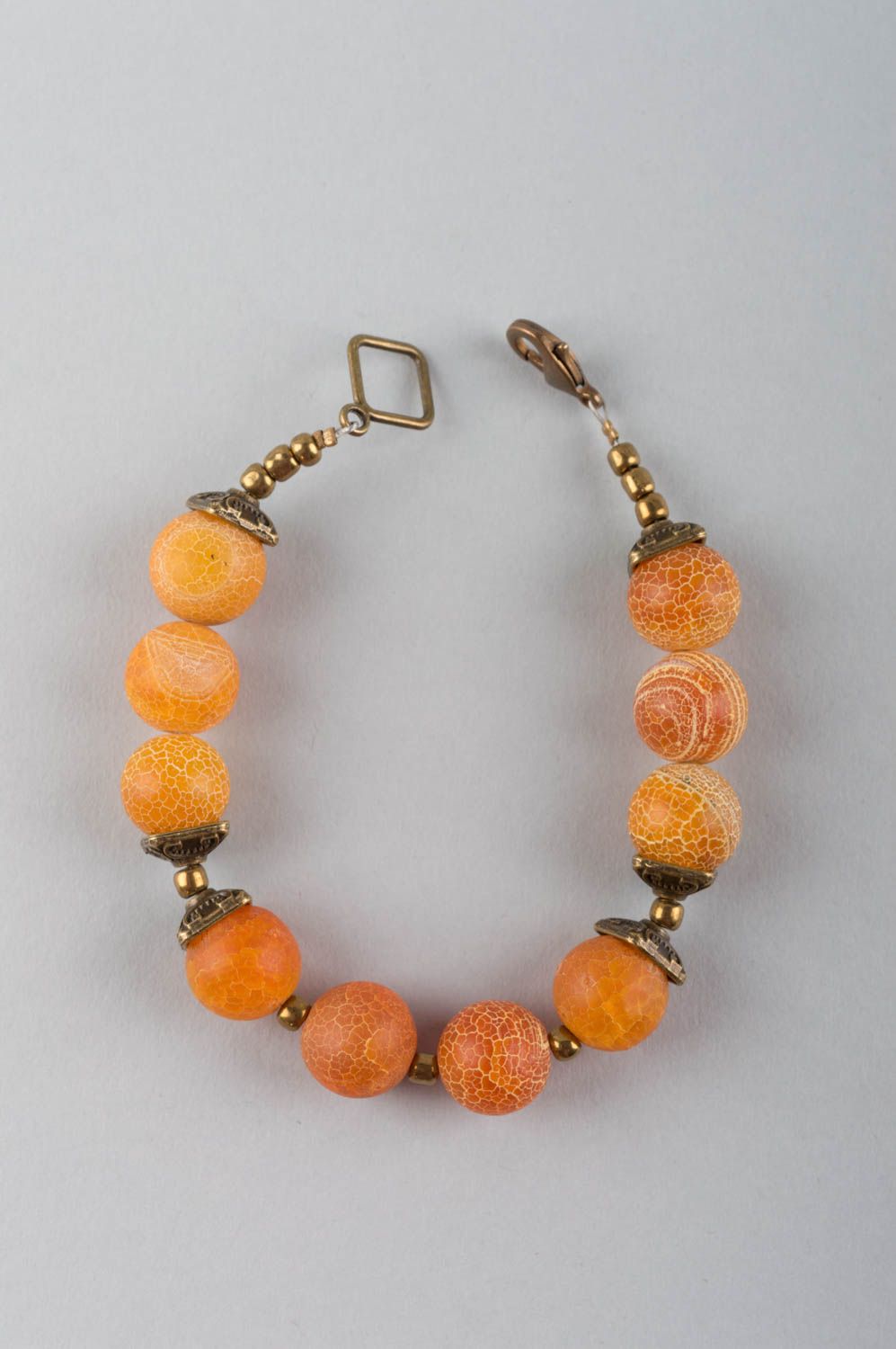 Beautiful elegant orange designer handmade bracelet made of agate and brass photo 2
