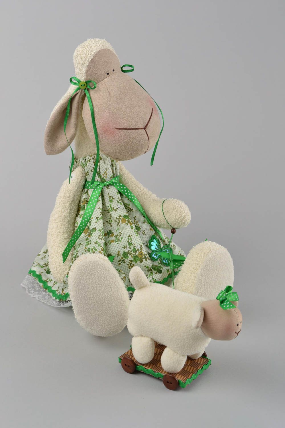 Handmade designer interior fabric soft toy Lamb in green dress with wheeled toy photo 1