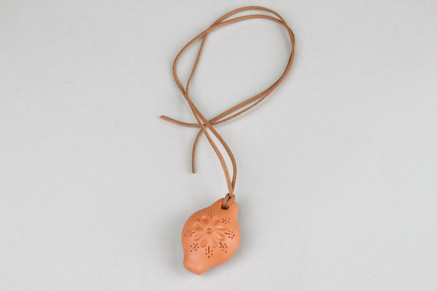 Ceramic tin whistle pendant with embossment photo 2