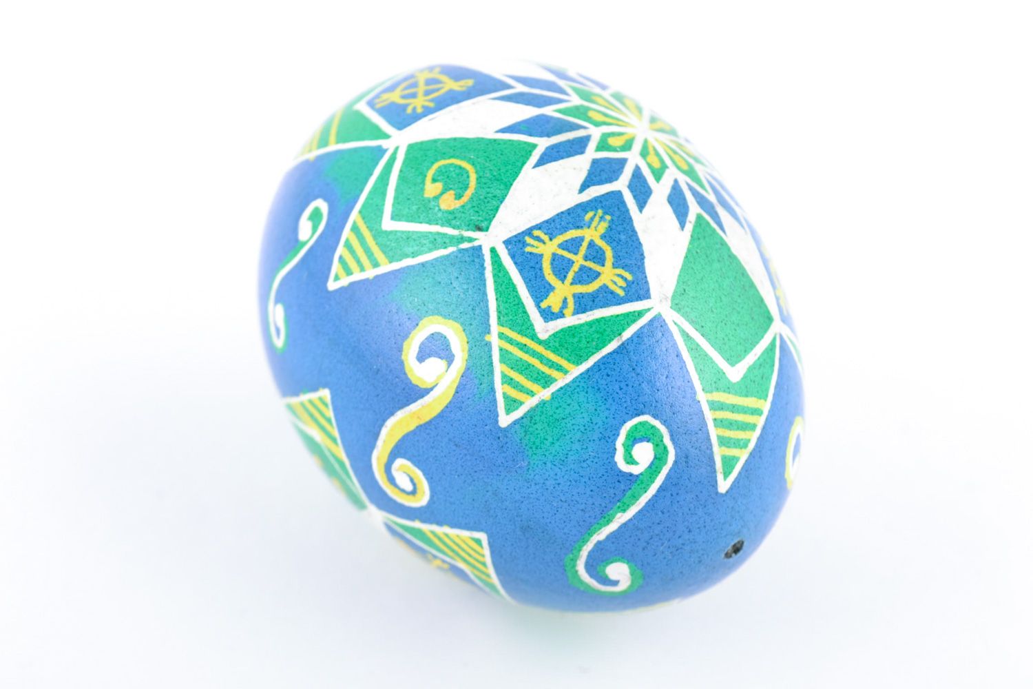 Handmade painted chicken egg with pattern of blue and green colors for Easter photo 3
