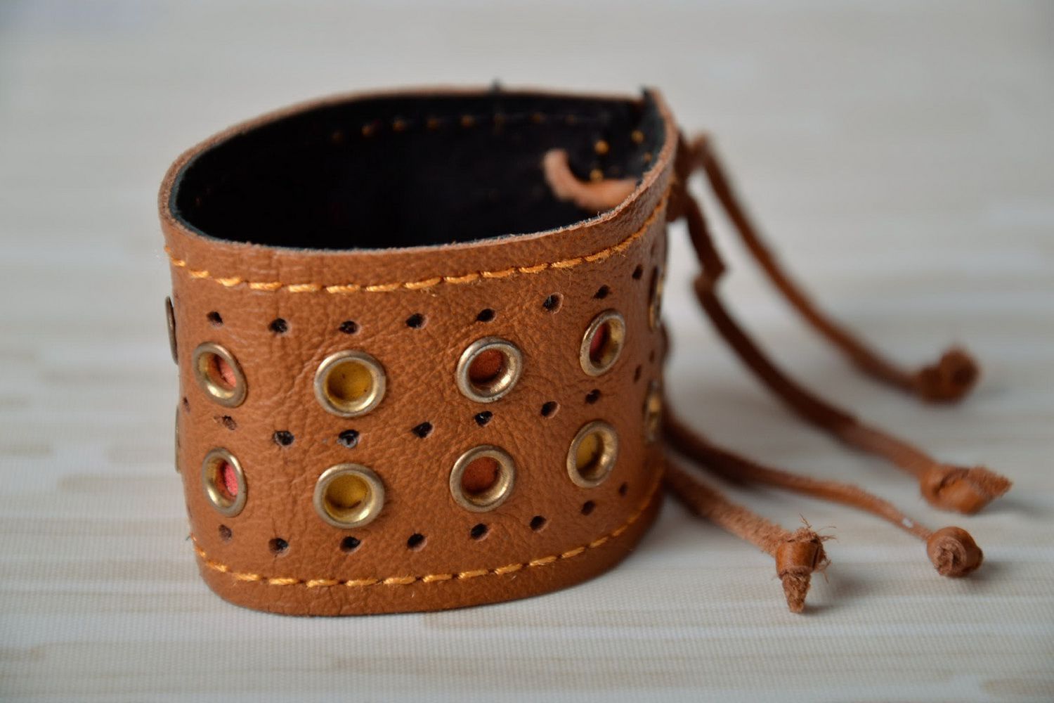 Brown leather bracelet with rivets photo 1