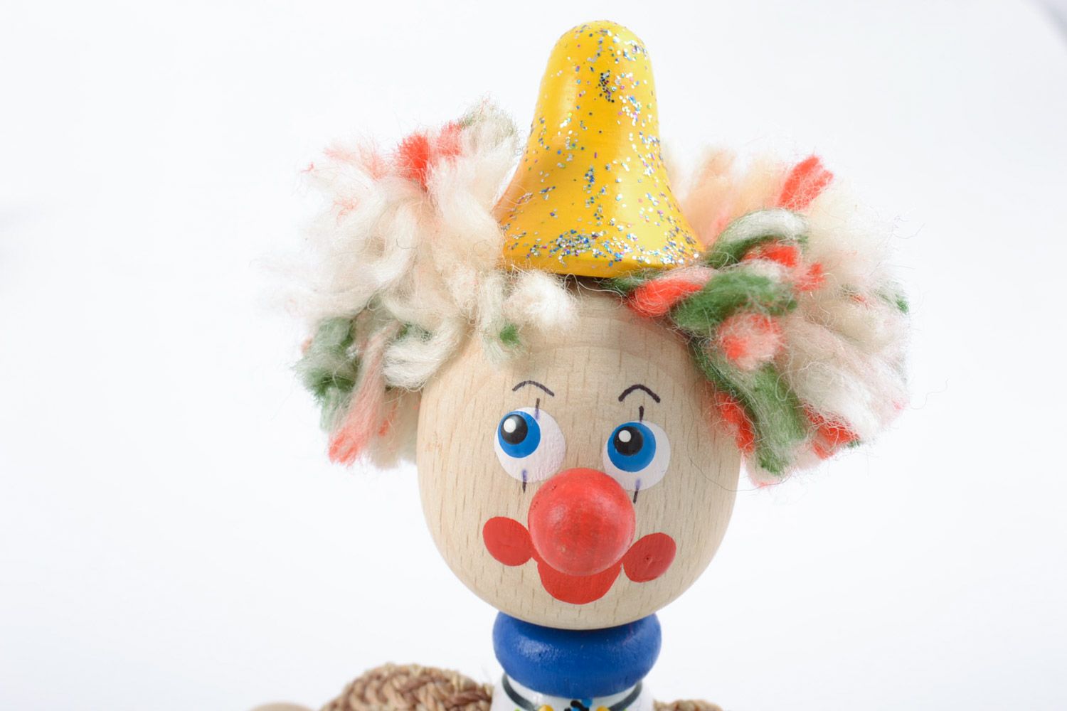 Bright homemade painted wooden toy in the shape of clown photo 3
