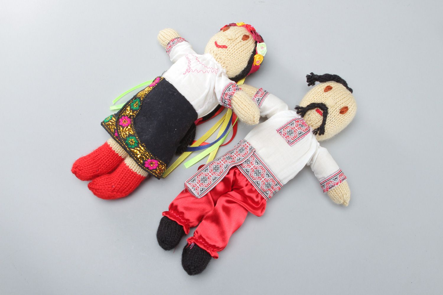 Handmade soft dolls in national costumes knitted of acrylic threads 2 items photo 1