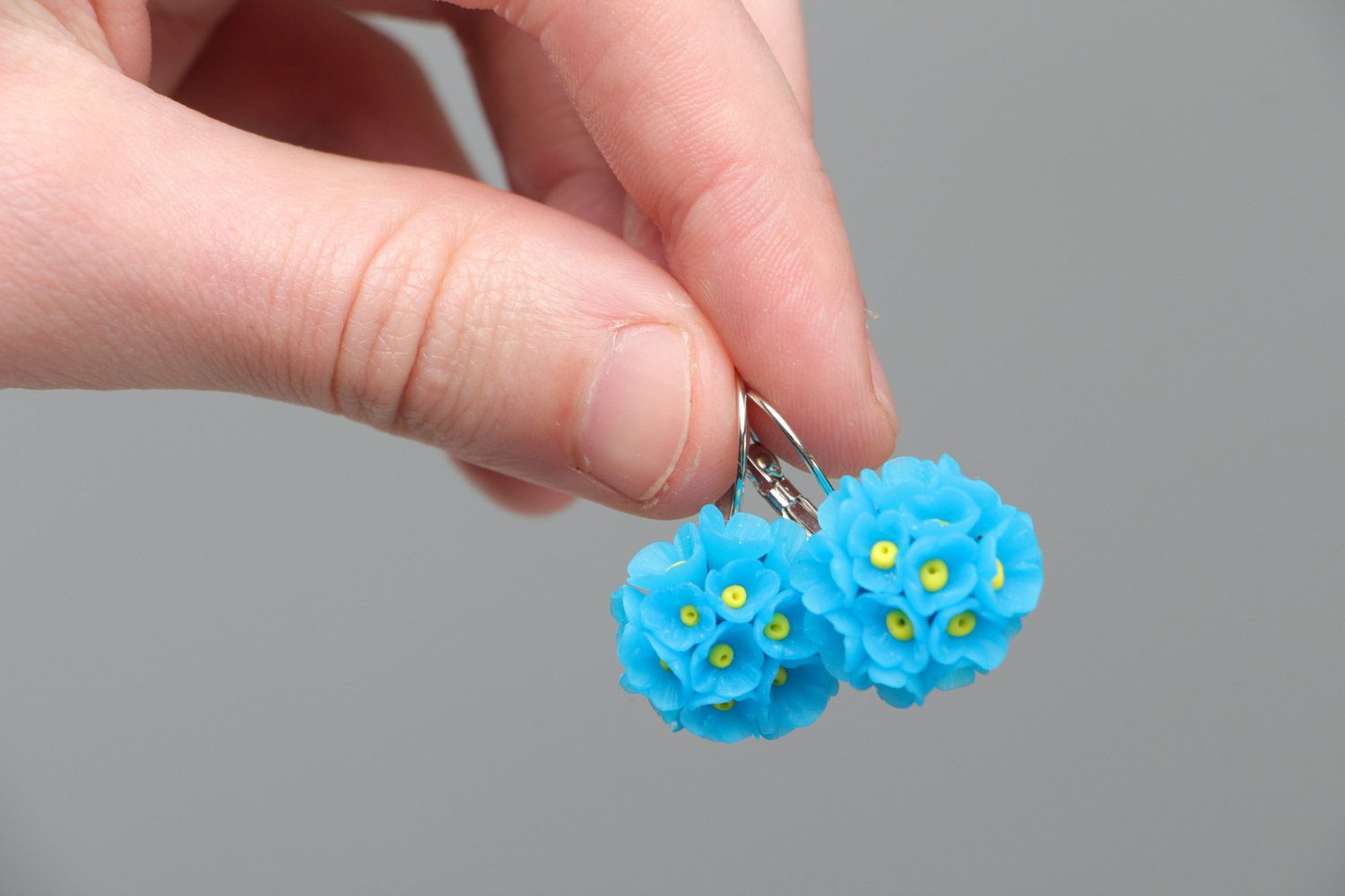 Small handmade polymer clay dangling earrings in the shape of blue flowers photo 5