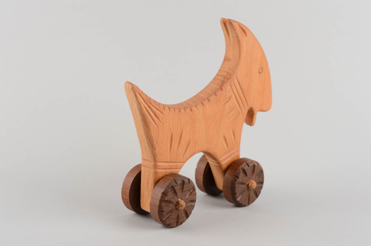 Eco friendly handmade wooden wheeled toy goat for children photo 4