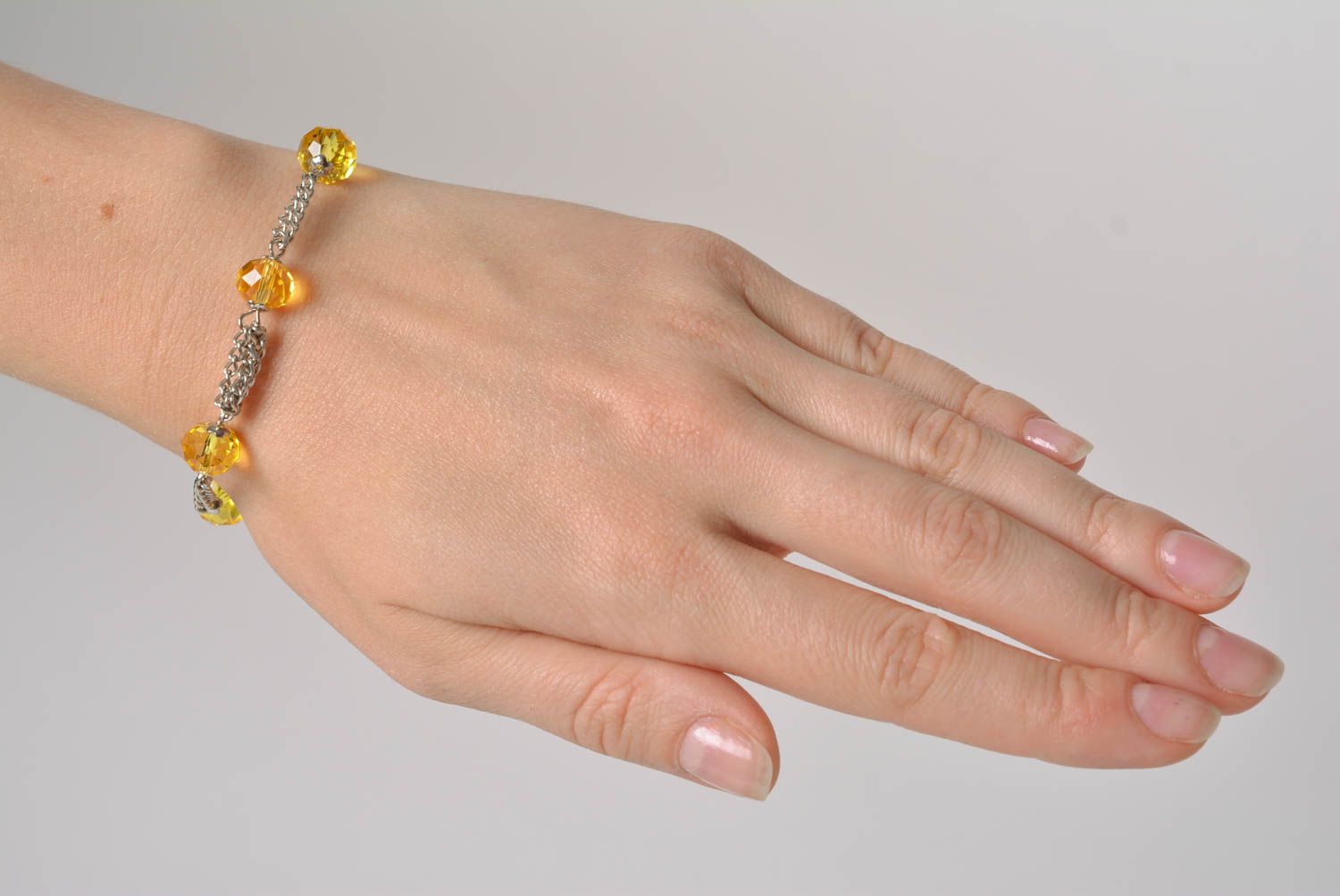 Handmade designer wrist bracelet with yellow glass beads and metal chain photo 3