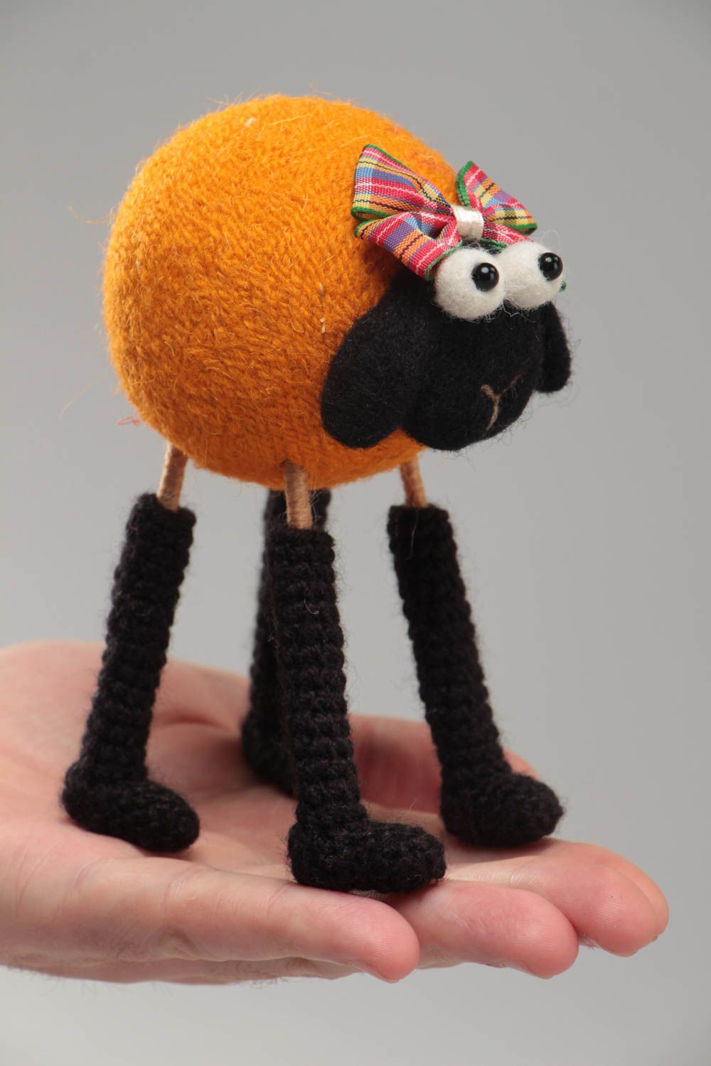 Handmade funny soft toy crocheted and felted of wool orange lamb on wooden paws photo 5