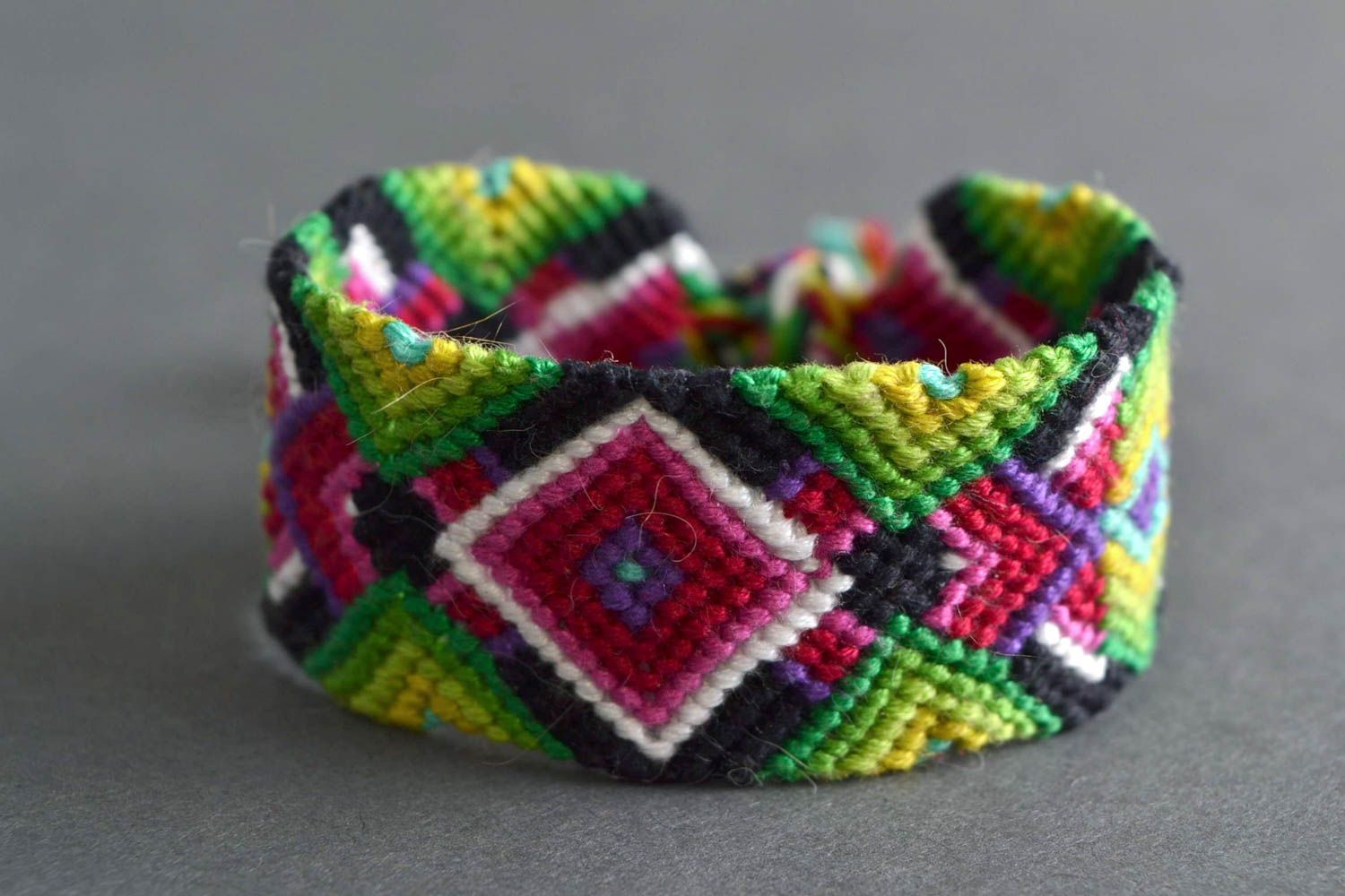 Handmade bright colorful friendship wrist bracelet woven of embroidery floss photo 1