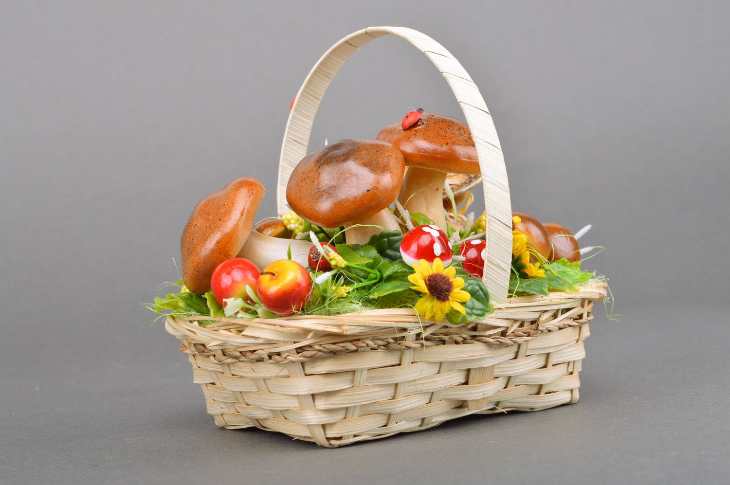 Handmade decorative sisal basket with fruit and mushrooms and frog figurine interior composition photo 2