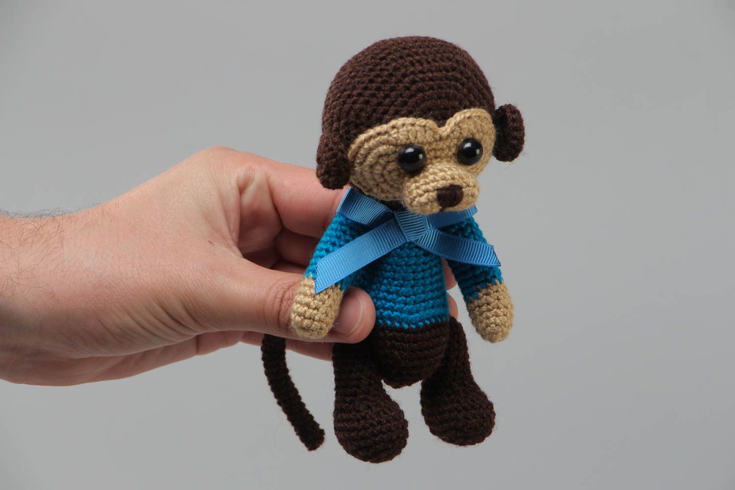 Handmade small crochet soft toy sad monkey in blue sweater with bow photo 5
