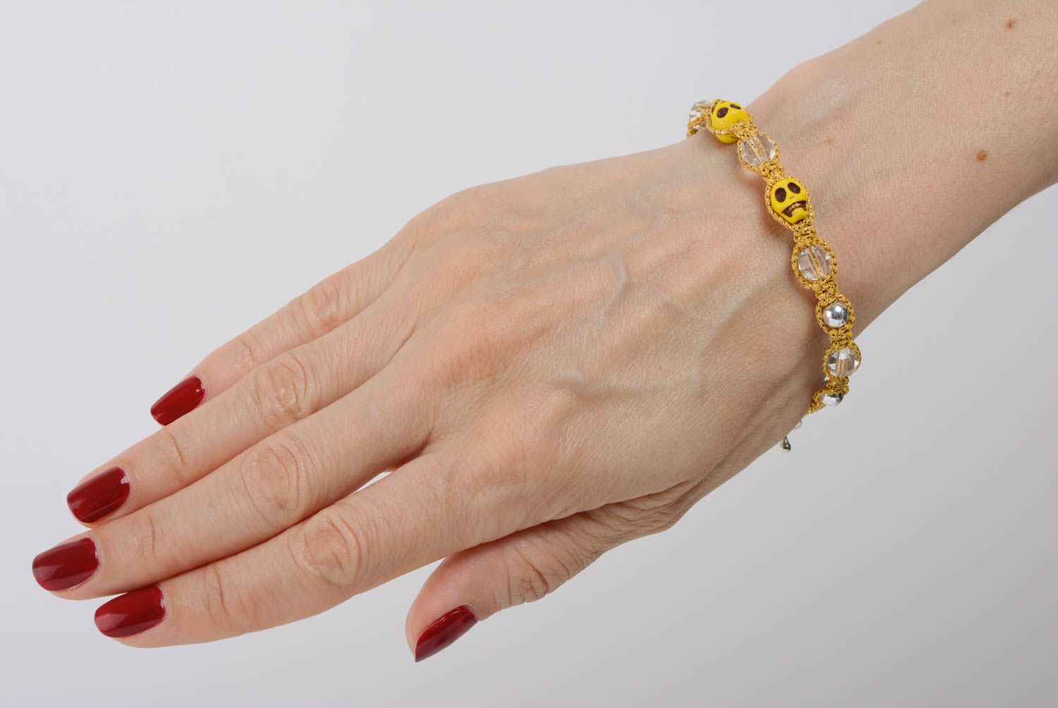 Beautiful yellow handmade macrame woven wrist bracelet with skulls adjustable photo 3