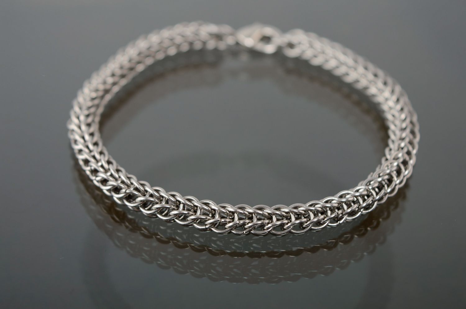 Handmade unisex bracelet made of jewelry alloy photo 1