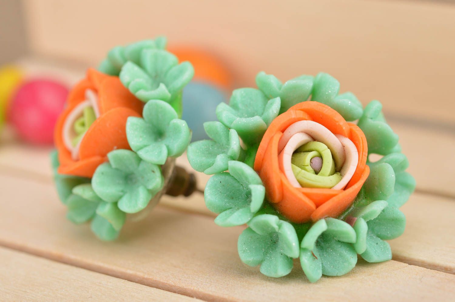 Handmade green and orange stud earrings made of polymer clay in shape of flowers photo 1