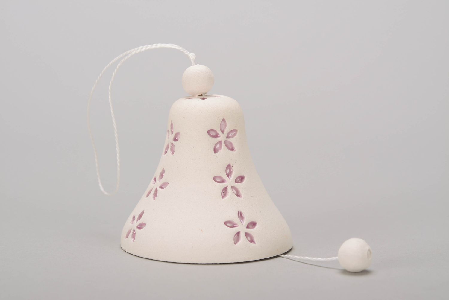 Bell made from white clay photo 3