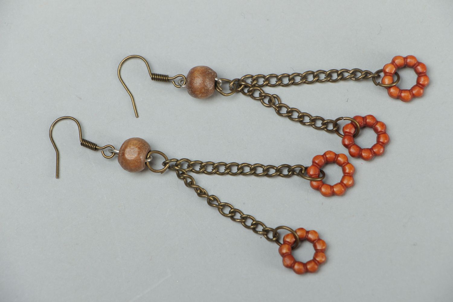 Handmade metal earrings with wooden beads photo 1