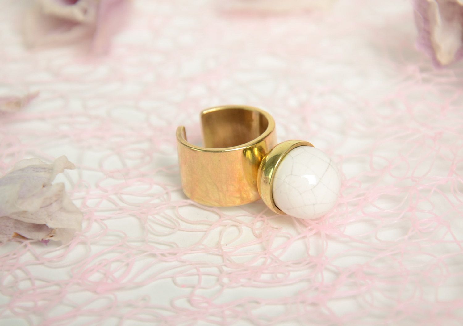 Handmade designer ring with massive latten basis and white round ceramic bead photo 1