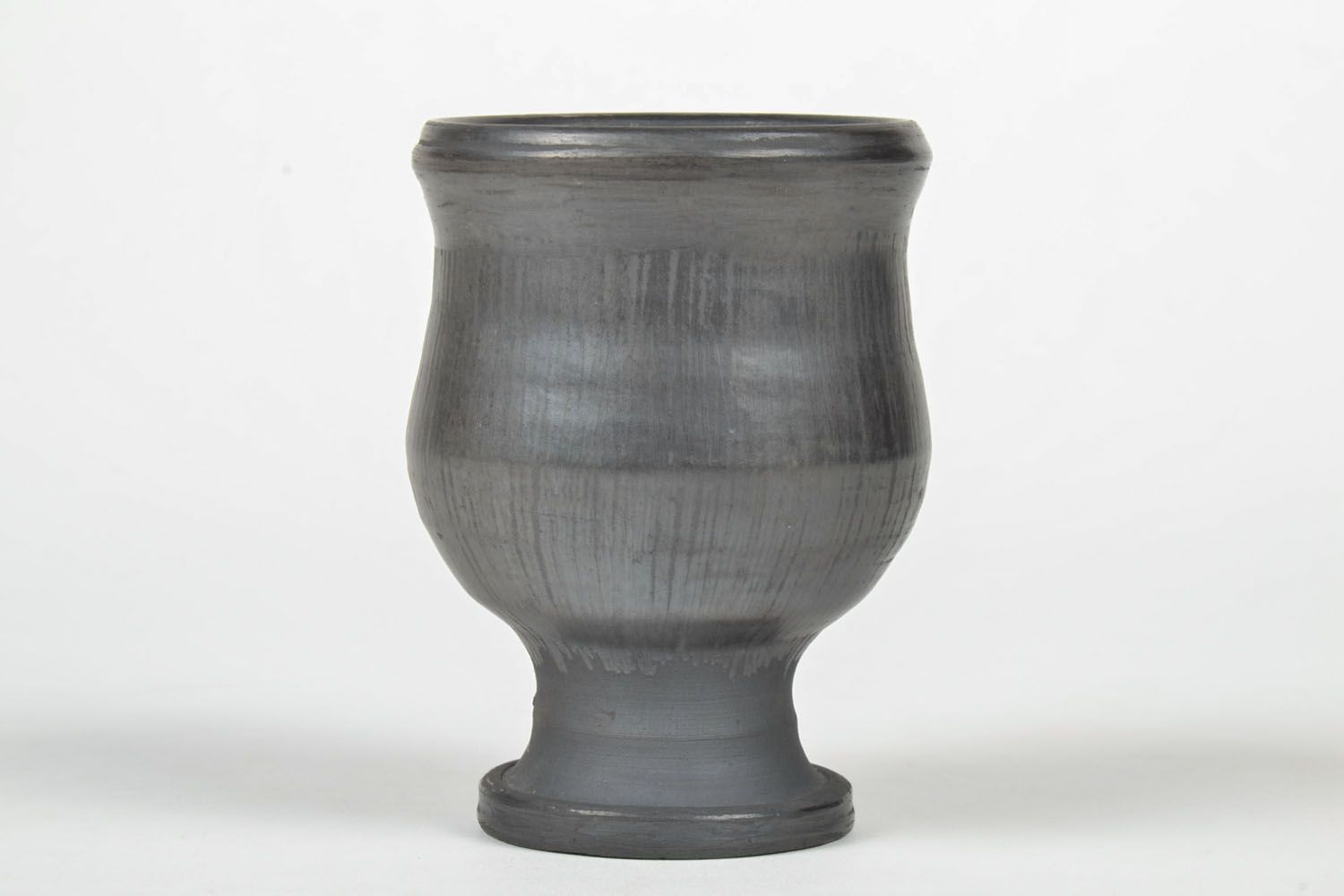 Wine goblet in black color on the stand without a handle. Great natural clay gift. photo 2