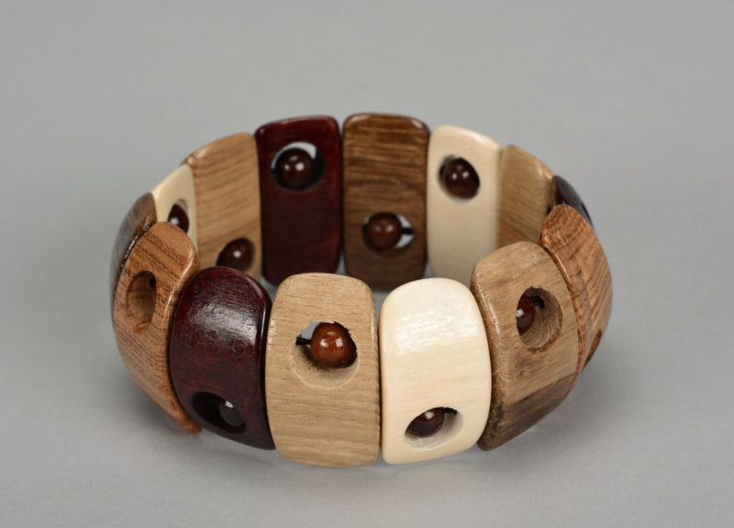 Beautiful brown wrist bracelet with round beads photo 1