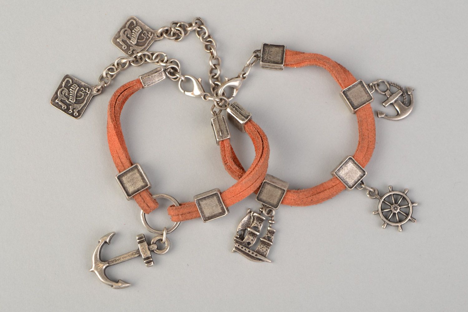 Set of 2 handmade suede cord wrist bracelets of peach color with metal charms  photo 3