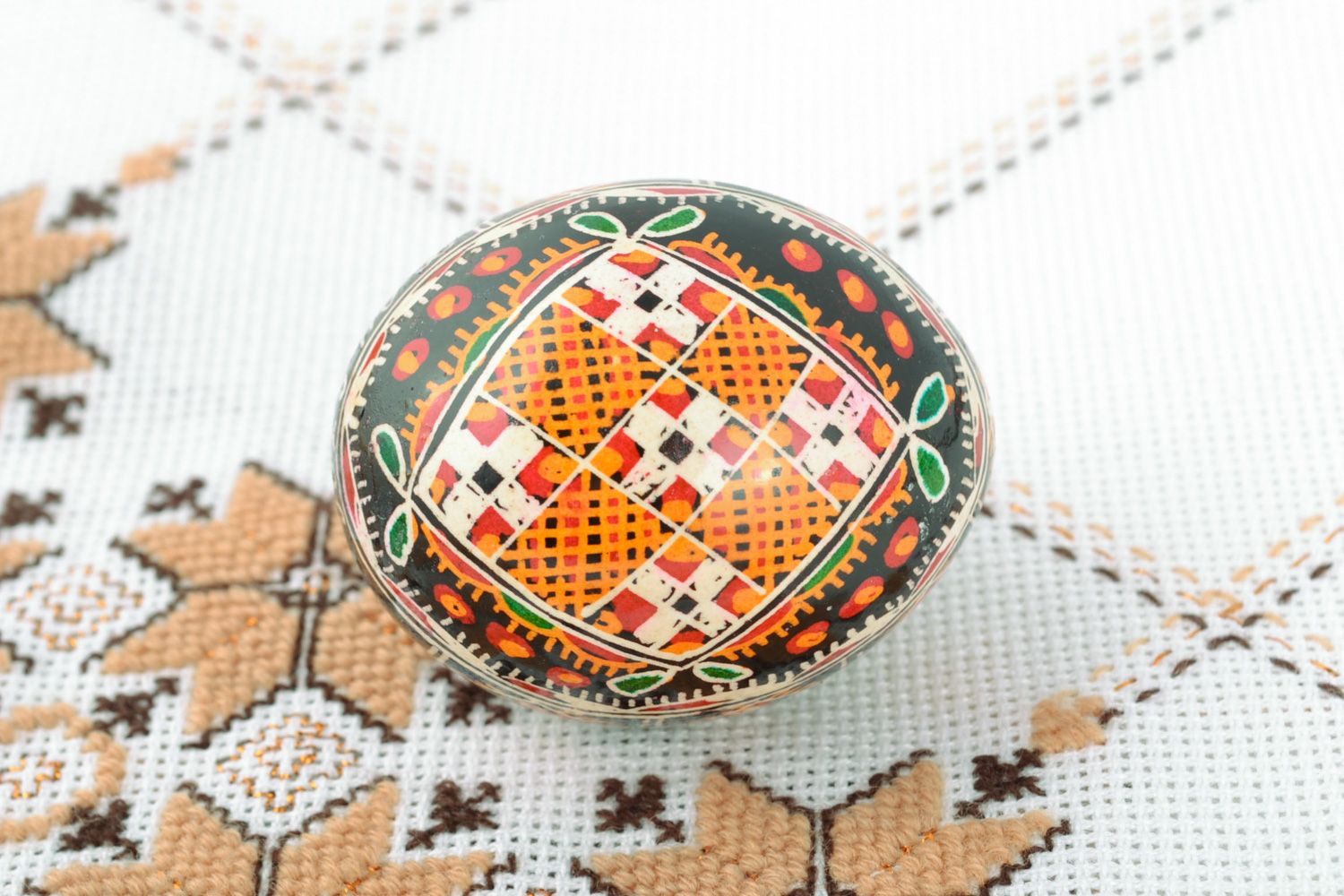 Homemade ornamented Easter egg pysanka with traditional painting made with hot wax photo 1