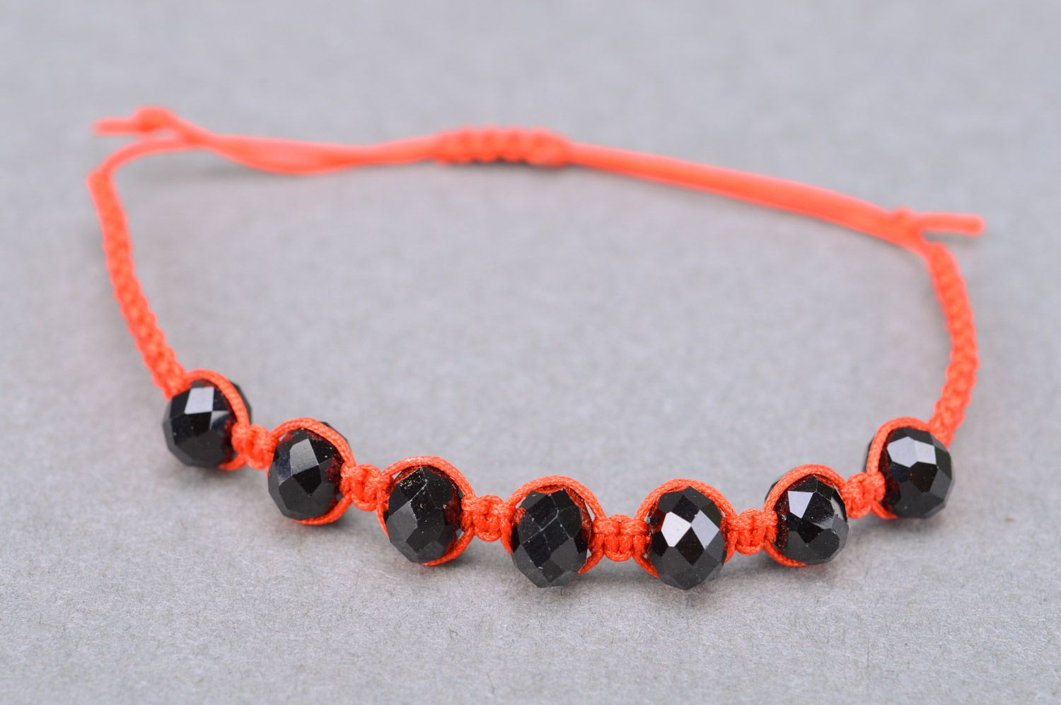Handmade woven thread bracelet with beads of orange color and universal size photo 2