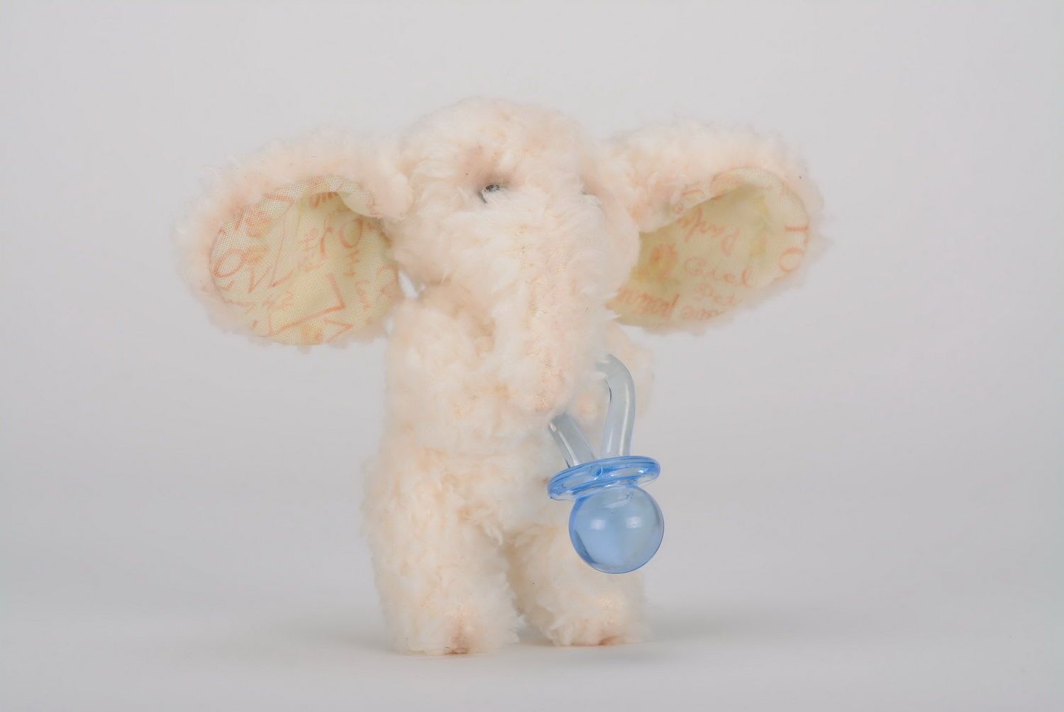 Soft toy, made of frazzle Elephant with pacifier photo 1