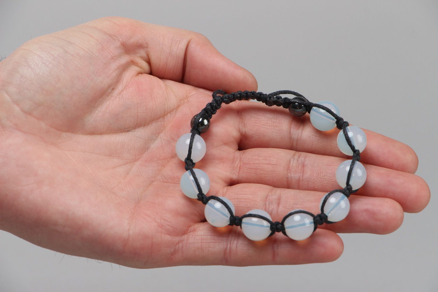 Handmade wrist bracelet woven of waxed cord with hematite and moon stone for women photo 3
