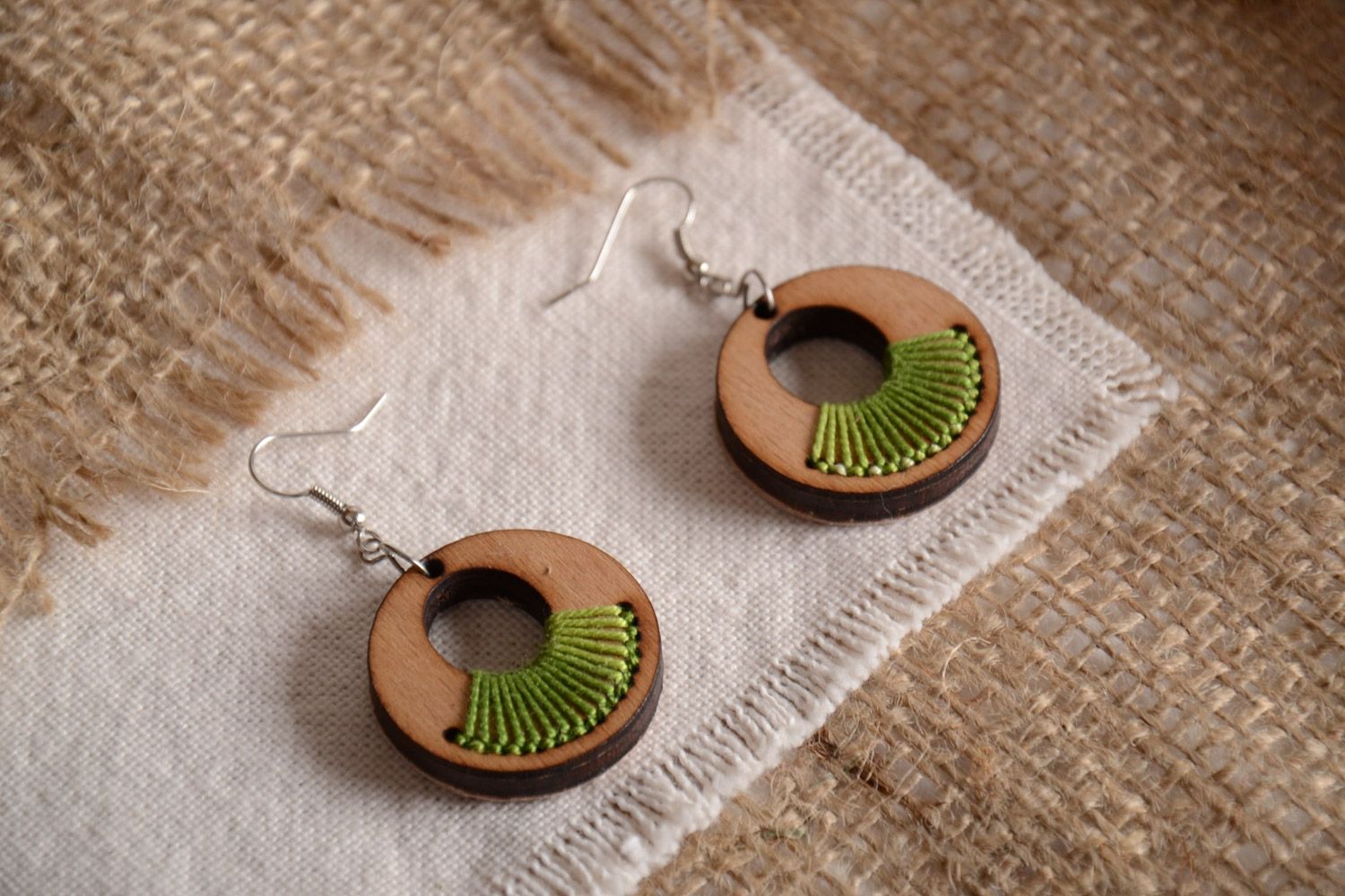Handmade round shaped plywood earrings with green embroidery  photo 1