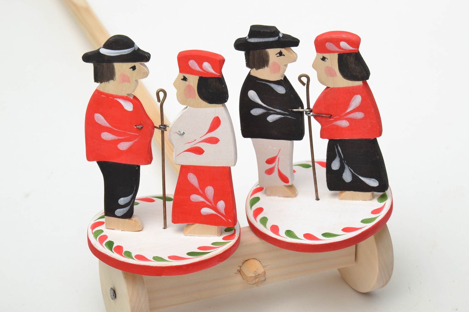 Handmade wooden wheeled toy with ethnic painting photo 4