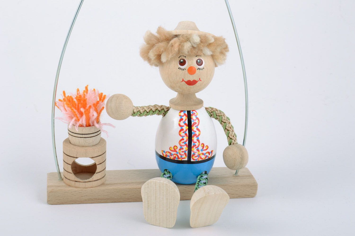 Деревянная игрушка мальчик на качелях с росписью ручной работы авторская фото 4