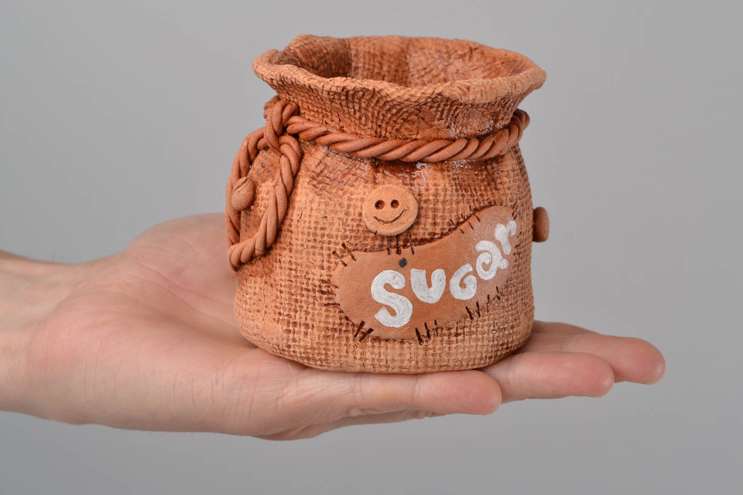 Clay small brown handmade pot for sugar in shape of sack  photo 2