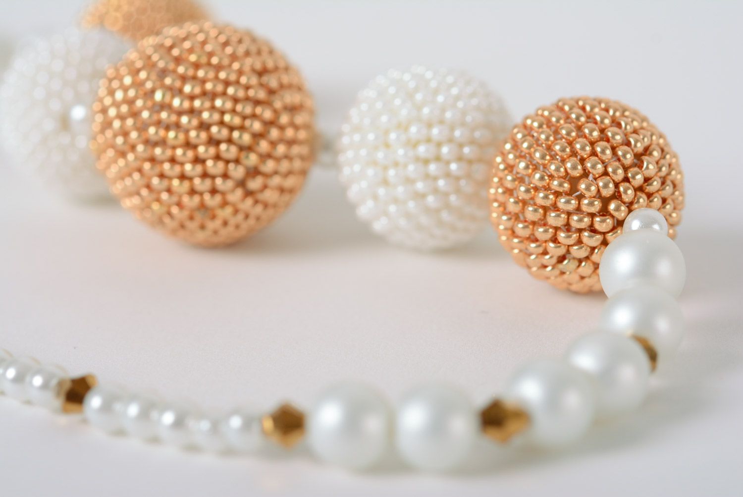 Tender handmade necklace with five balls woven of white and golden beads  photo 5