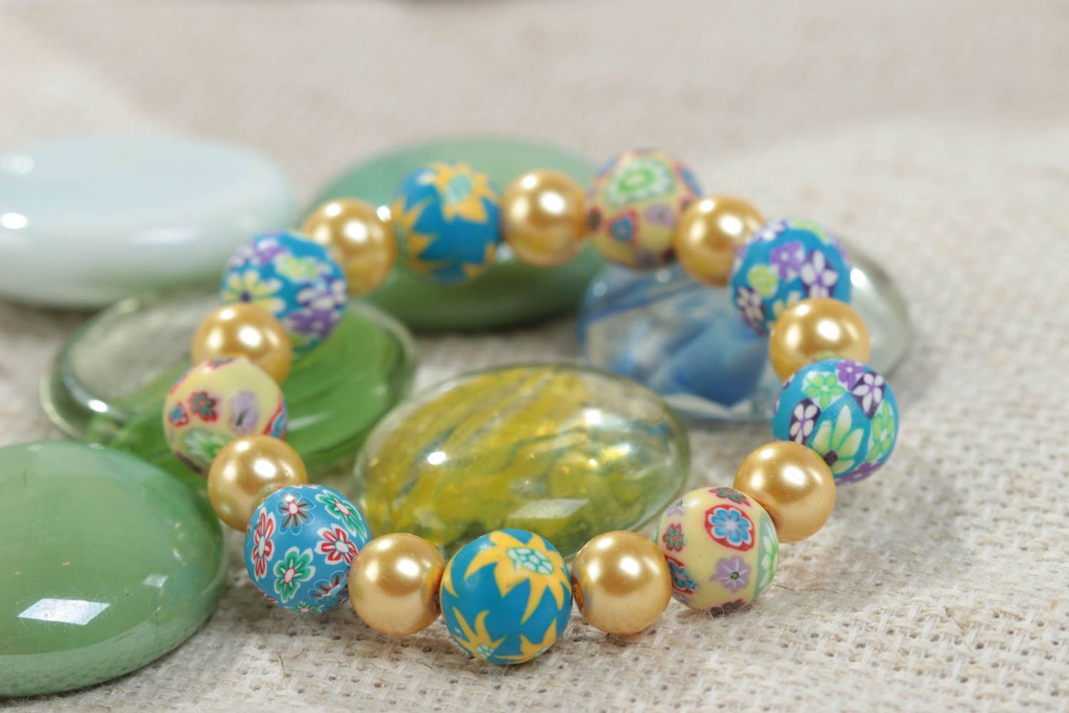 Homemade children's wrist bracelet created of polymer clay and ceramic beads photo 1