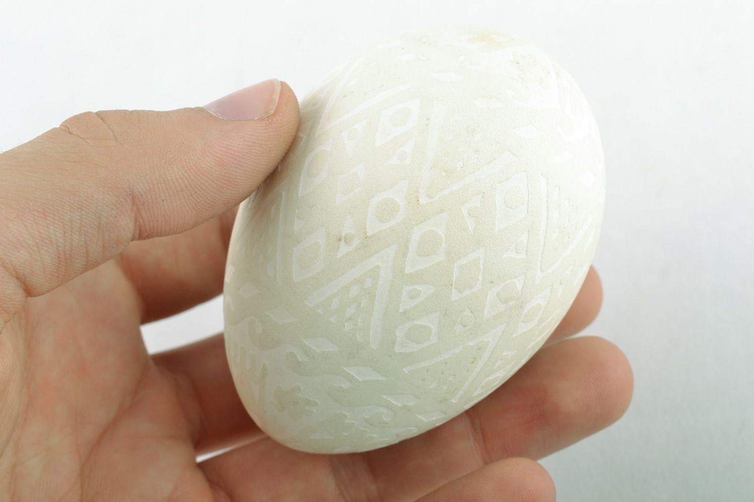 Handmade tender white Easter egg decorated using acid etching technique  photo 2