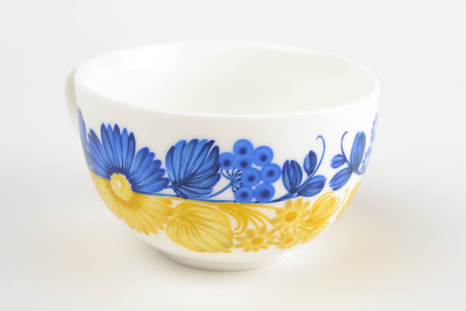 White wide ceramic porcelain cup in blue and yellow color with handle photo 4