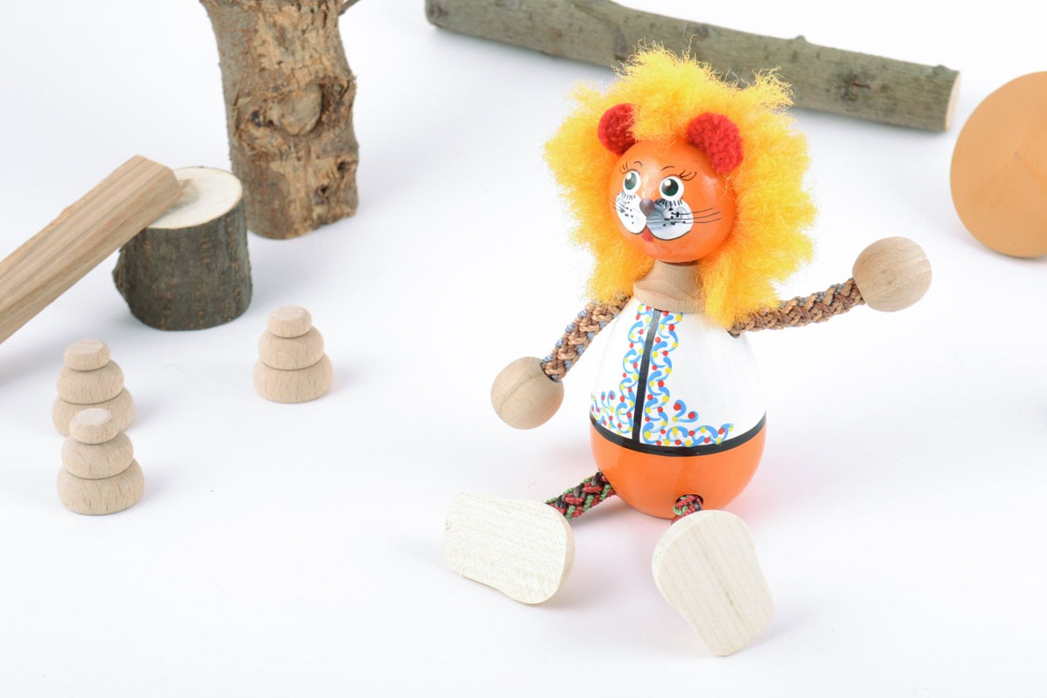 Bright painted eco friendly toy hand made of beech wood Lion with cord paws  photo 1