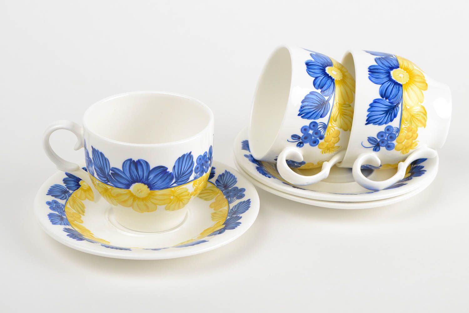 Set of 3 three porcelain white, blue, and yellow colors drinking cups with saucers photo 3