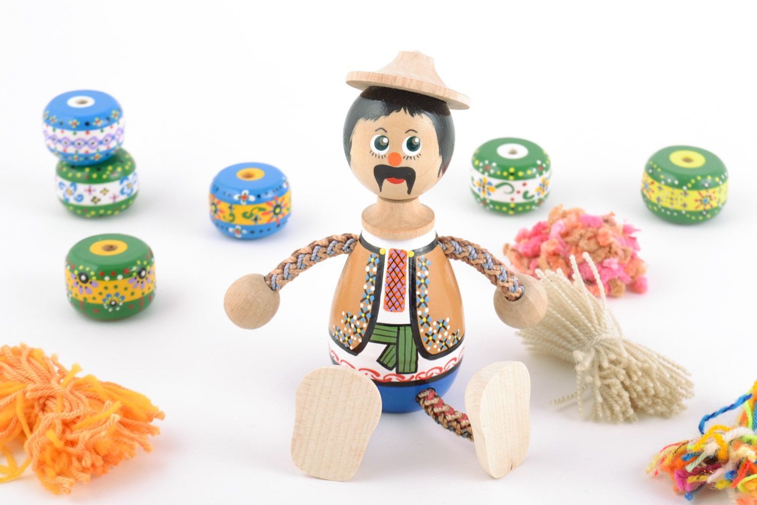 Handmade painted wooden eco toy in the shape of boy in national Ukrainian costume photo 1